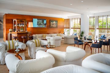 a room with white furniture and tables
