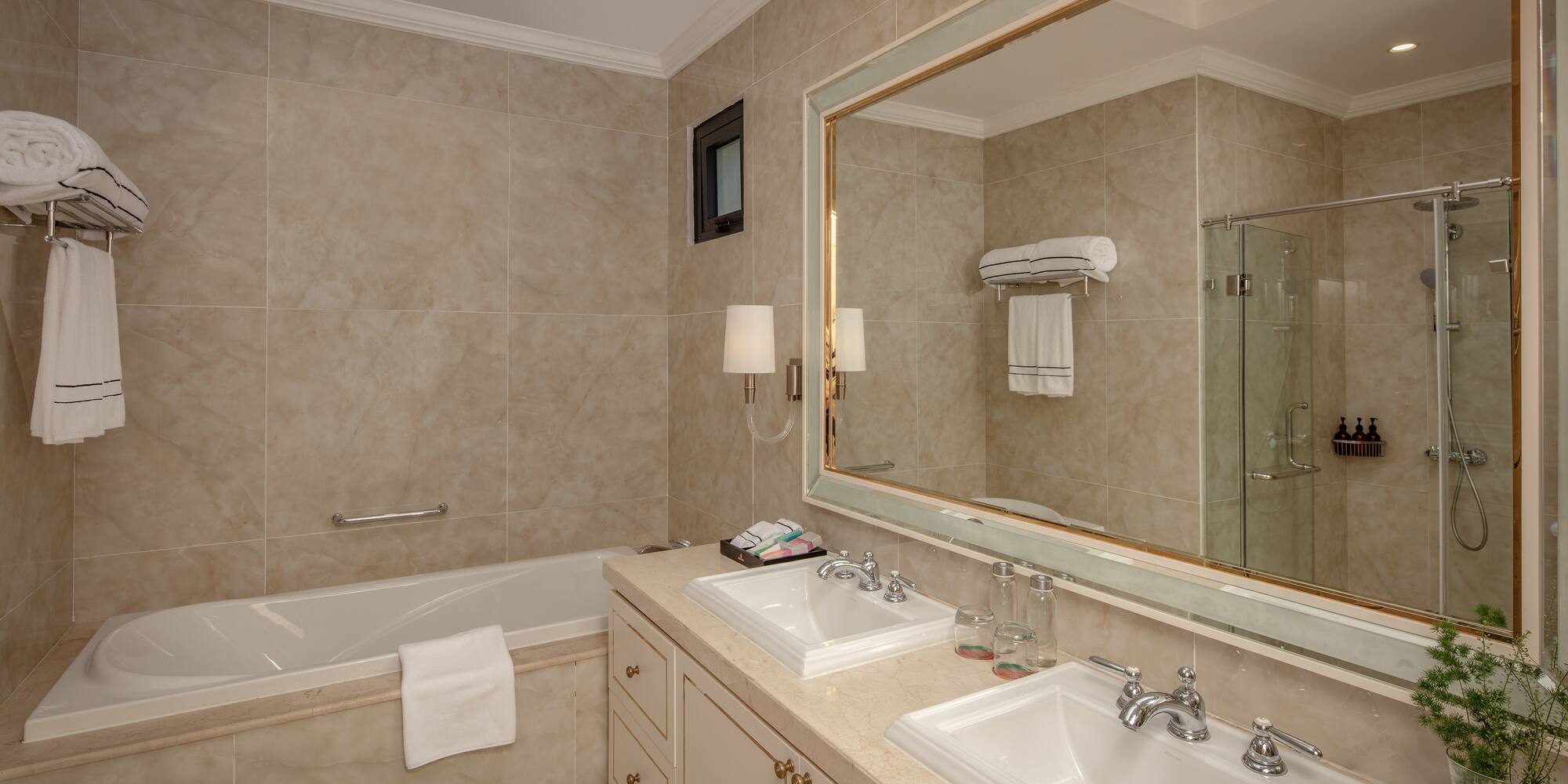 a bathroom with a large mirror and sink