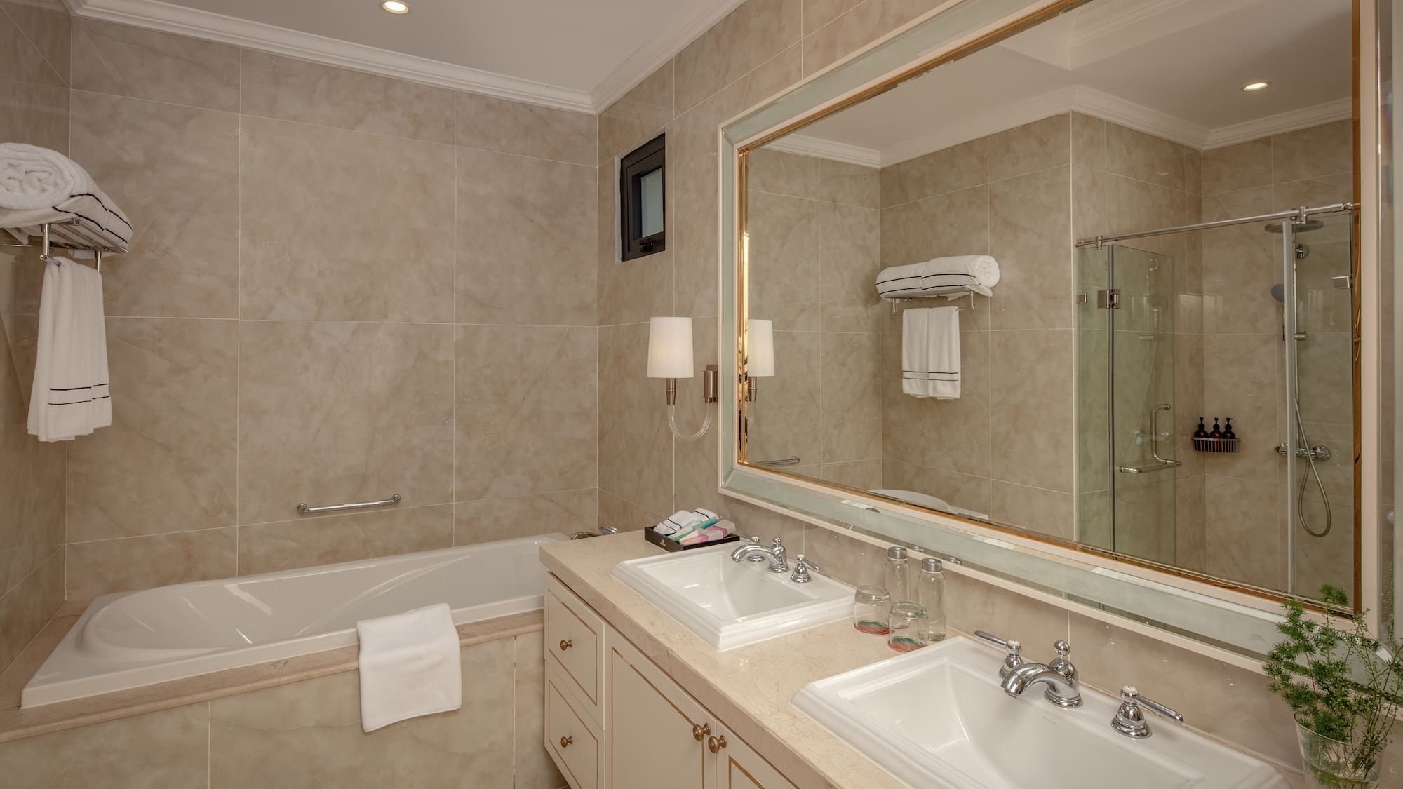 a bathroom with a large mirror and sink