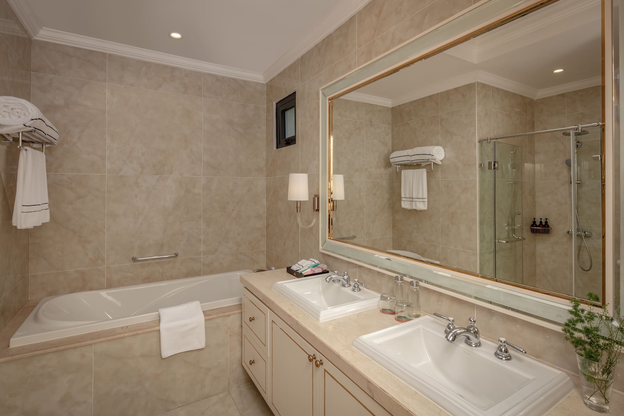 a bathroom with a large mirror and sink