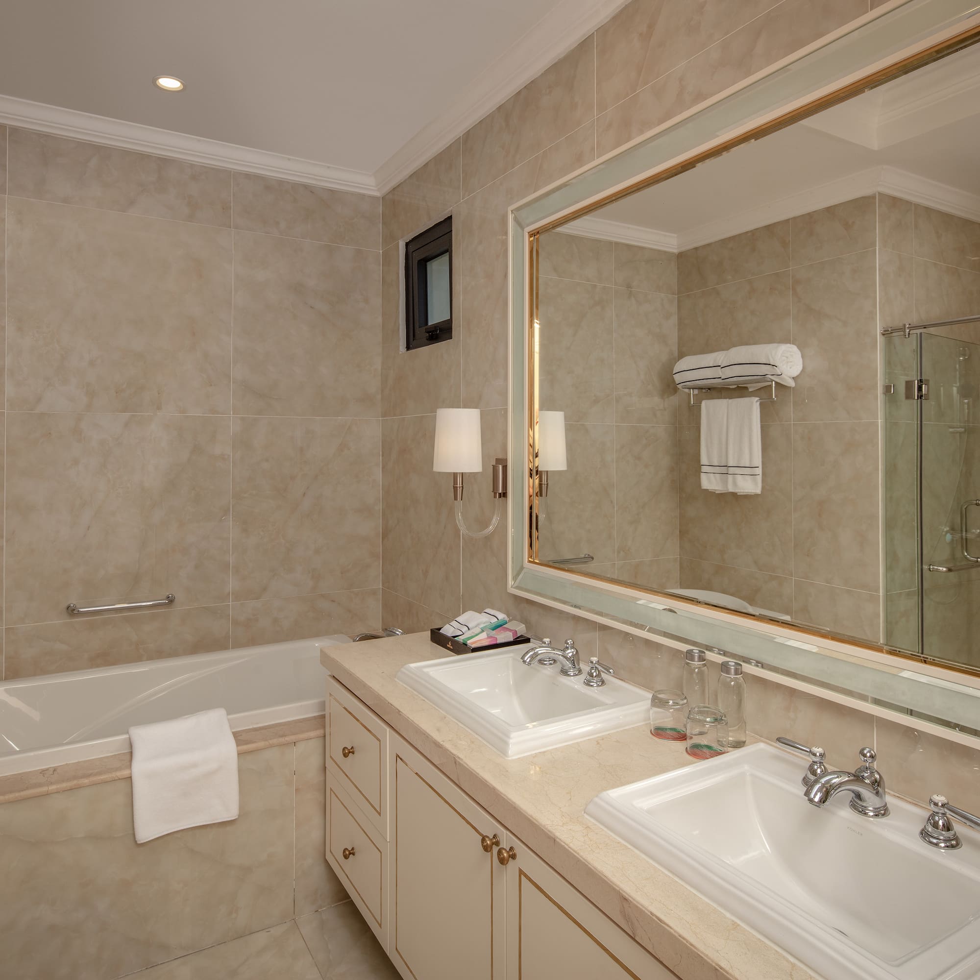 a bathroom with a large mirror and sink