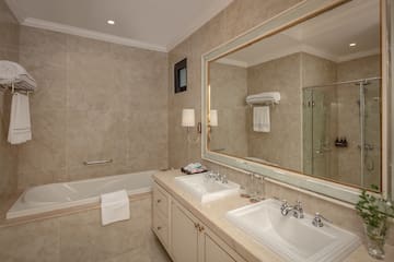 a bathroom with a large mirror and sink