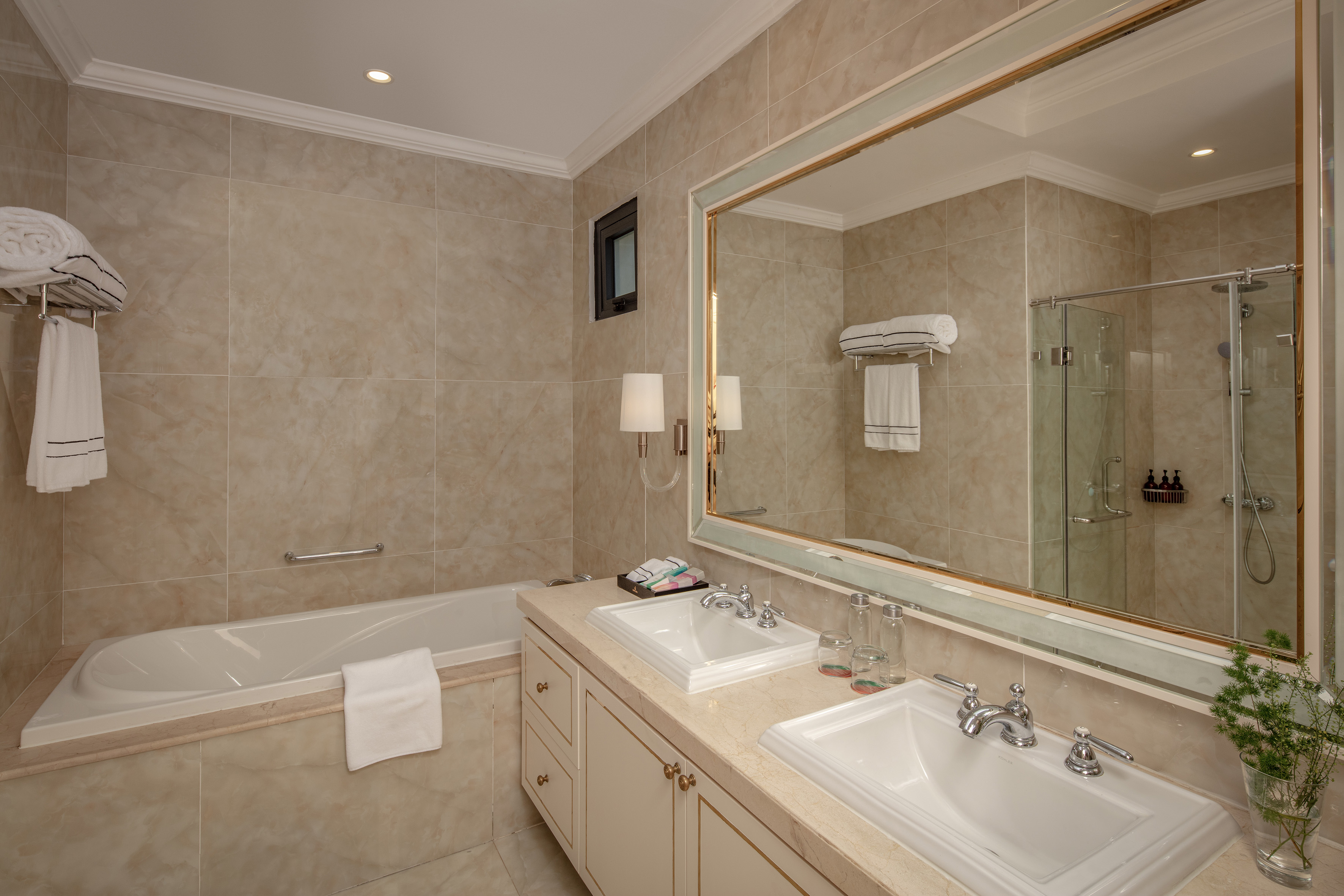 a bathroom with a large mirror and sink