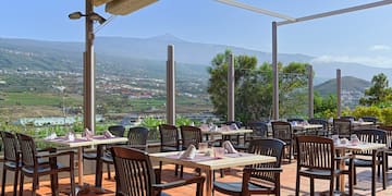 a restaurant with tables and chairs