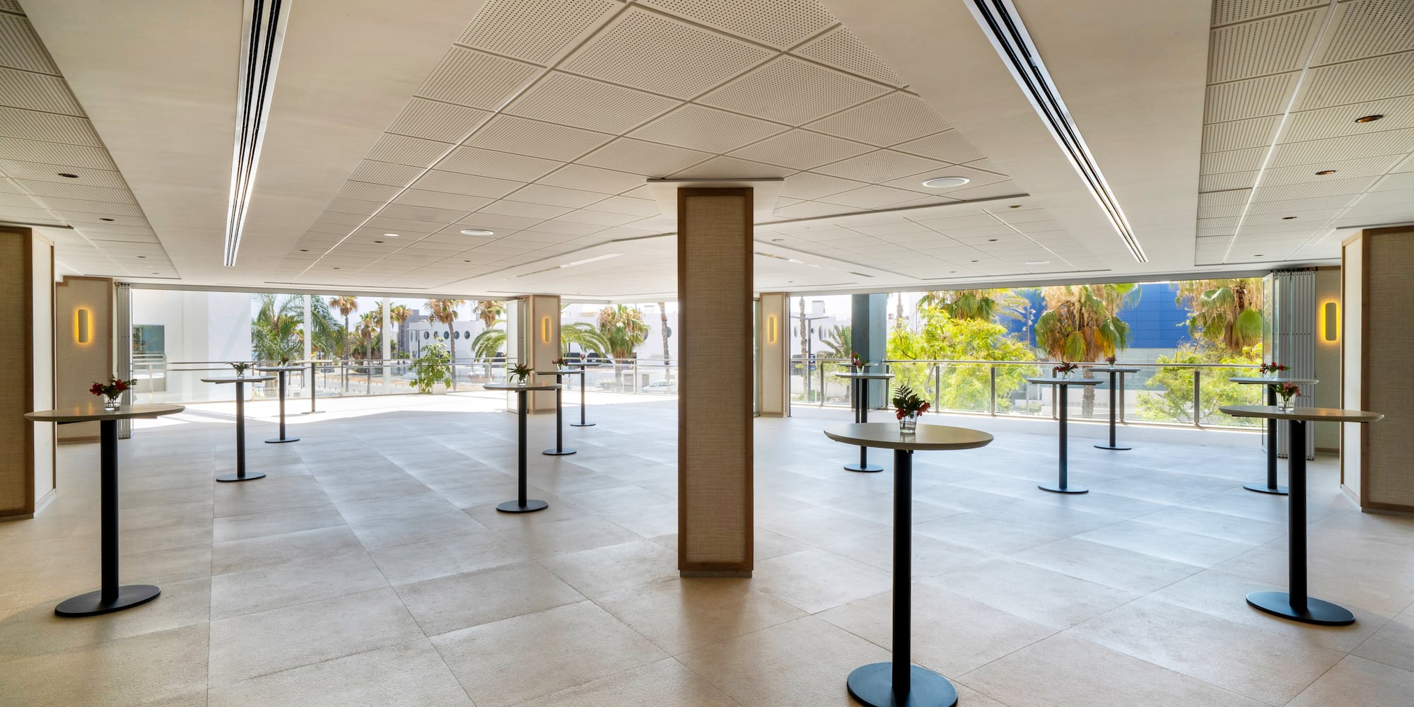 a room with tables and windows