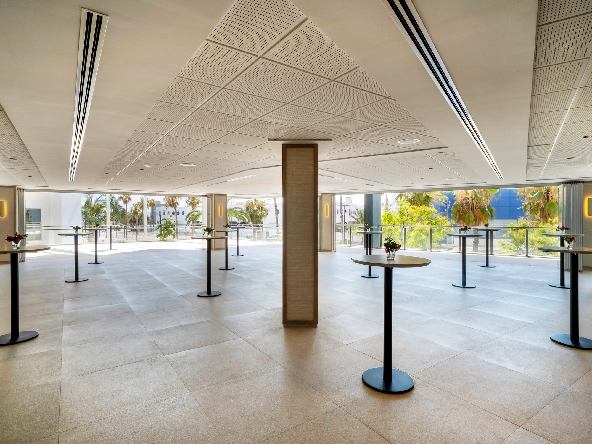 a room with tables and windows