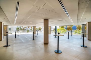 a room with tables and windows