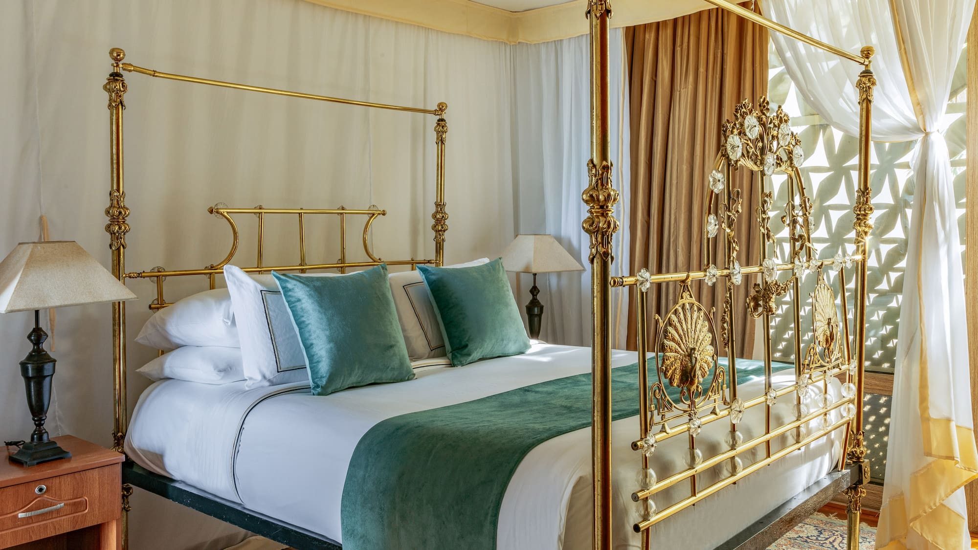 a bed with a gold frame