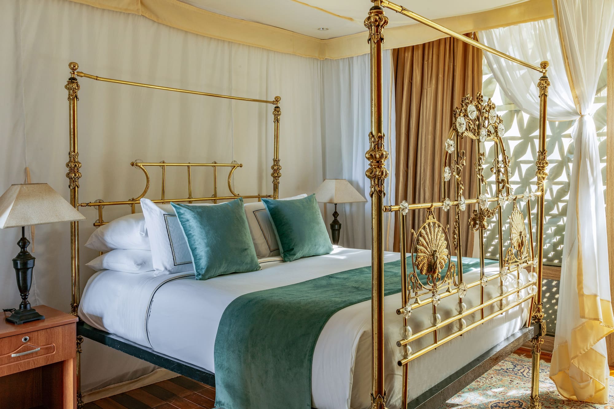 a bed with a gold frame