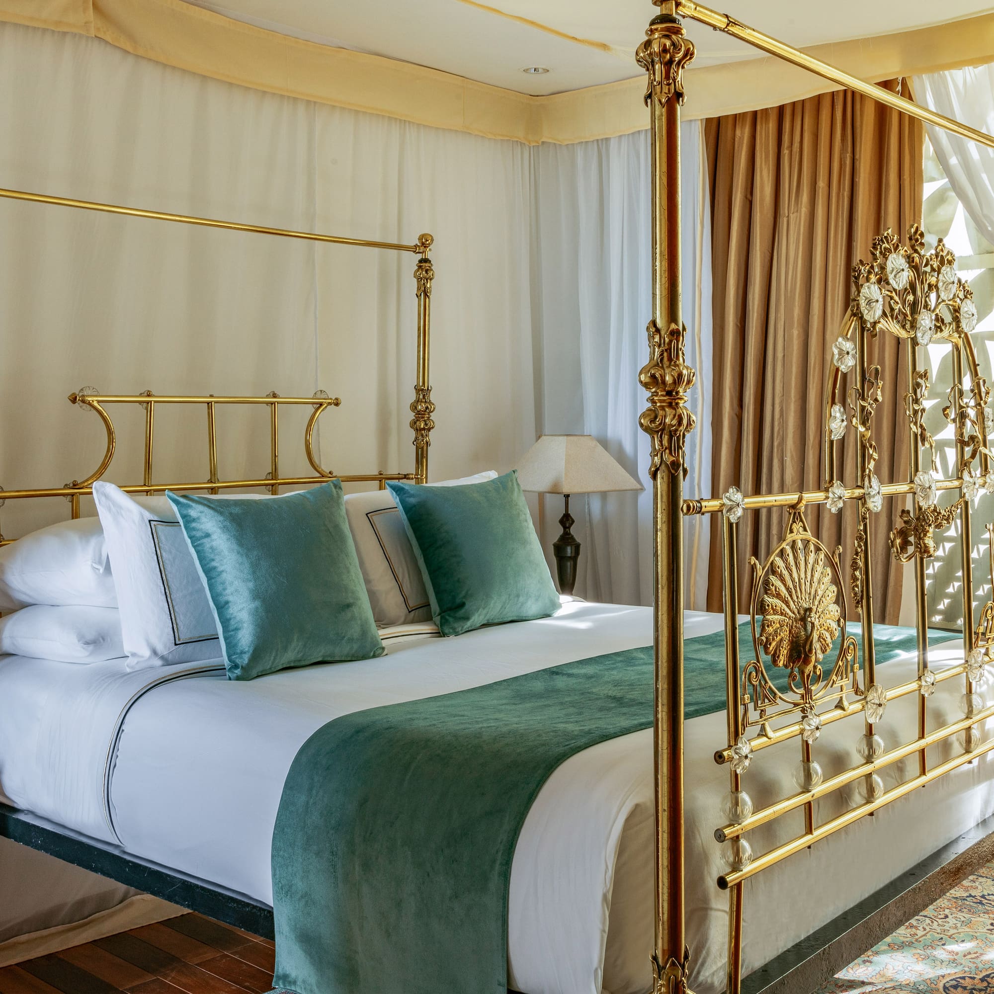 a bed with a gold frame