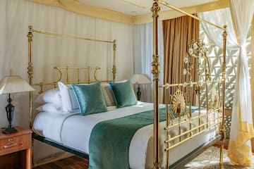 a bed with a gold frame