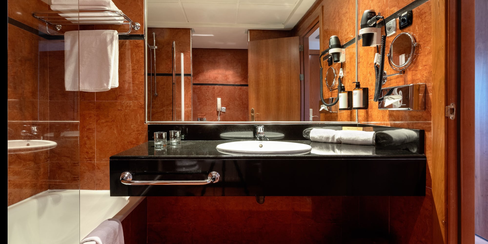 a bathroom with a mirror and a sink