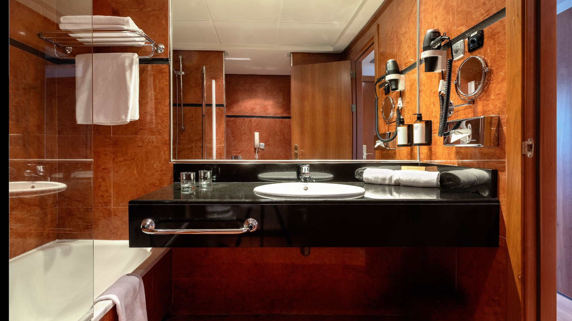 a bathroom with a mirror and a sink