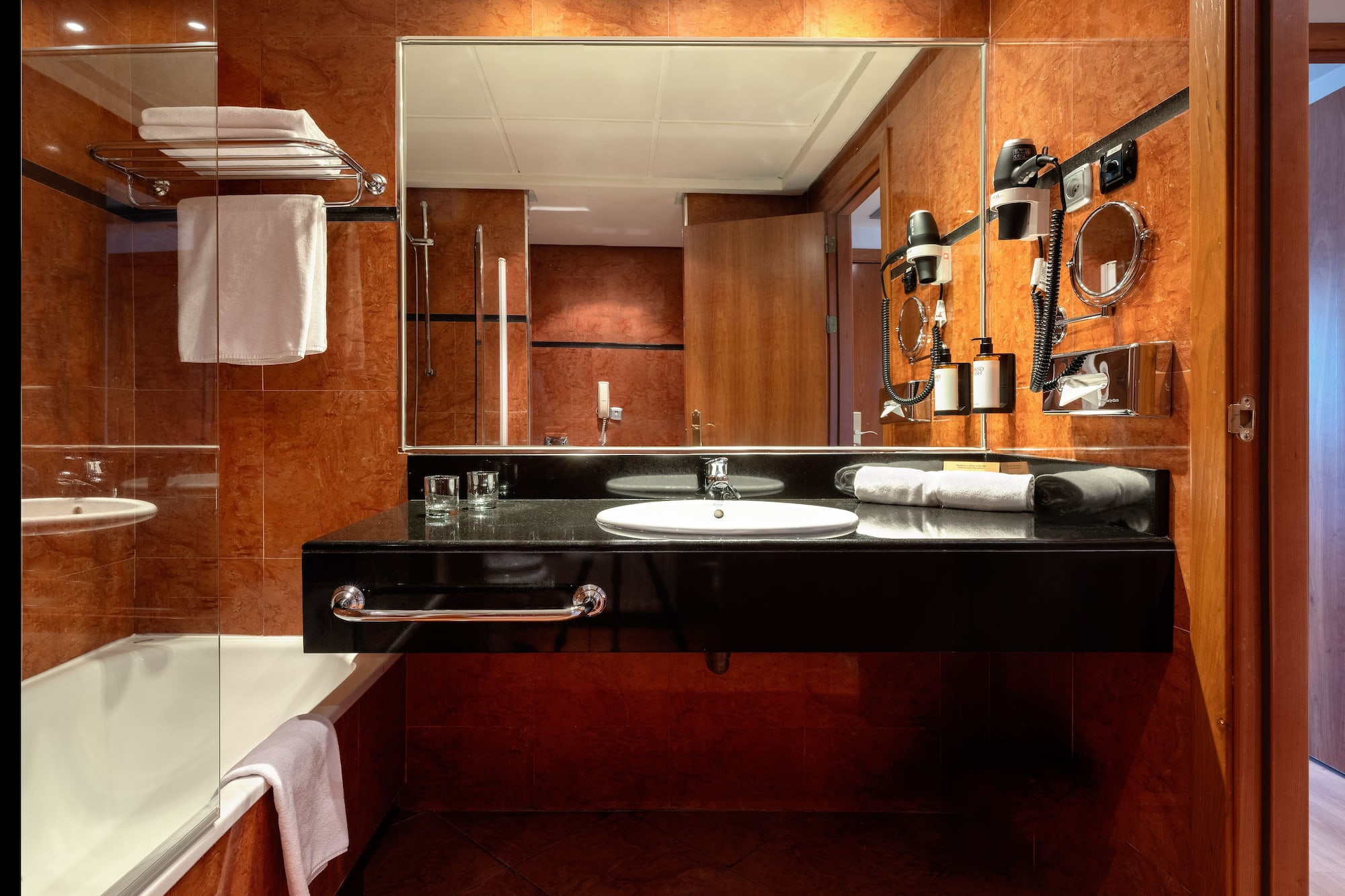 a bathroom with a mirror and a sink