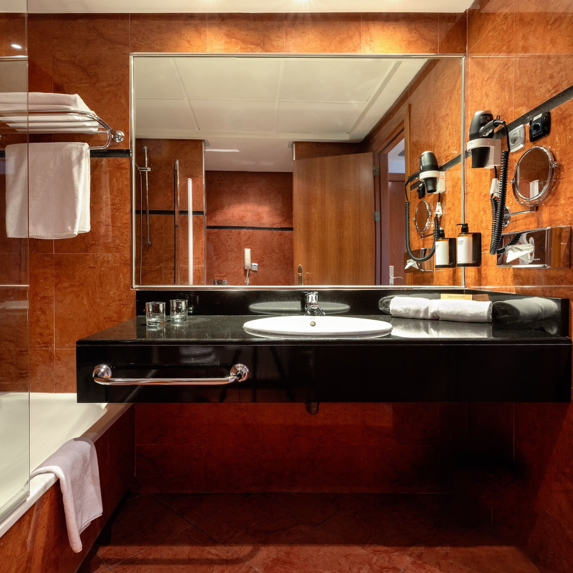 a bathroom with a mirror and a sink