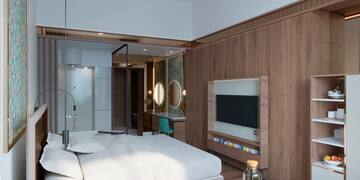 a room with a bed and a tv