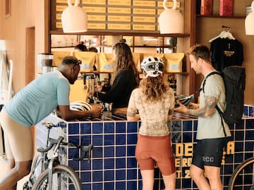 a group of people standing at a counter