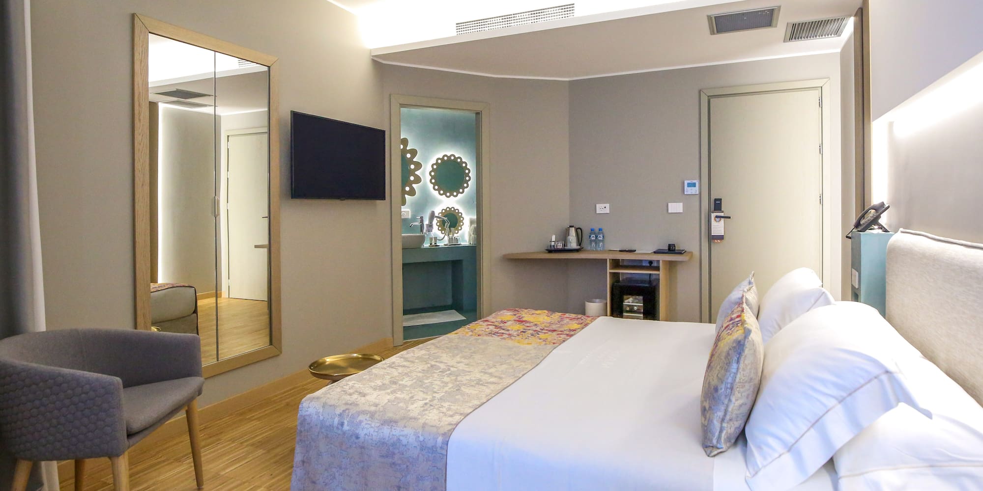 a room with a bed and a mirror