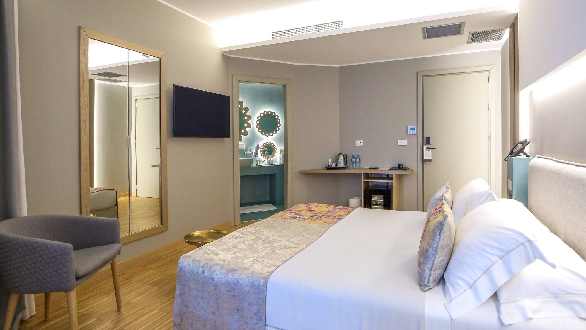 a room with a bed and a mirror