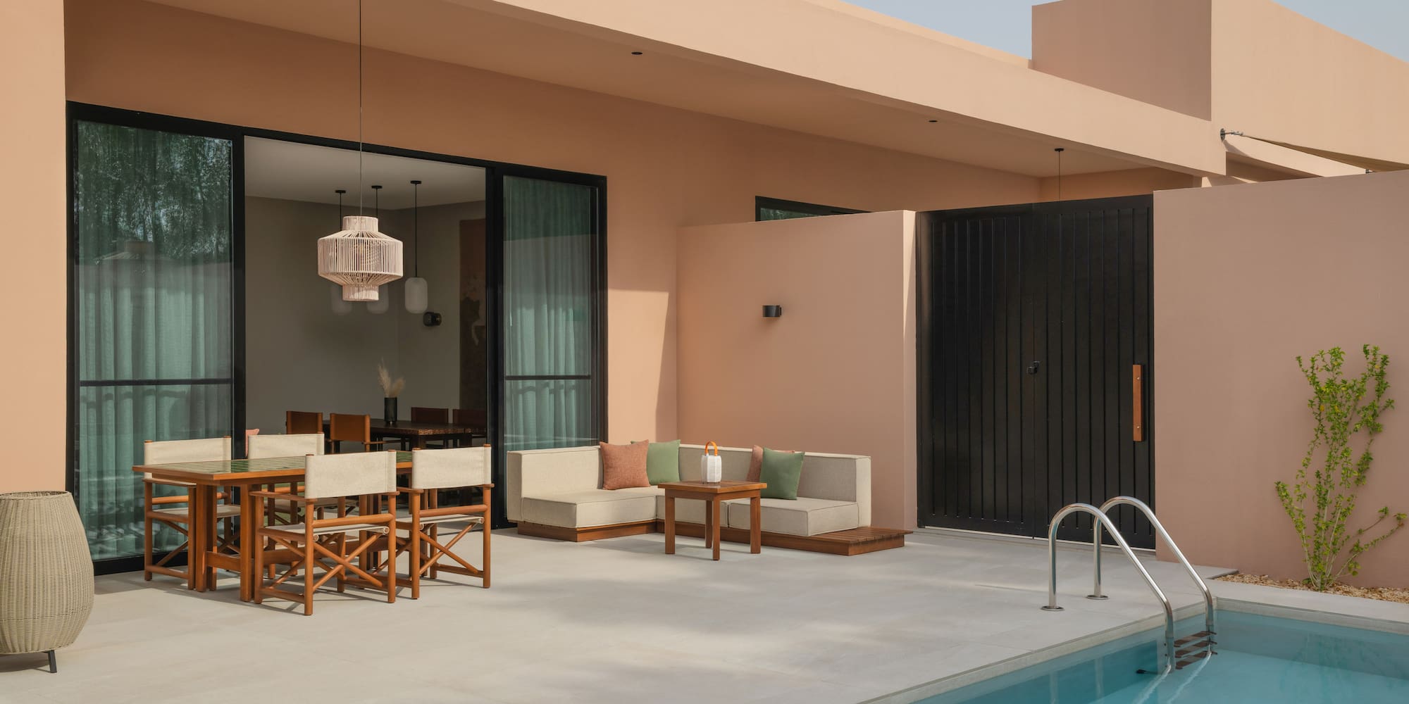 a pool with a table and chairs