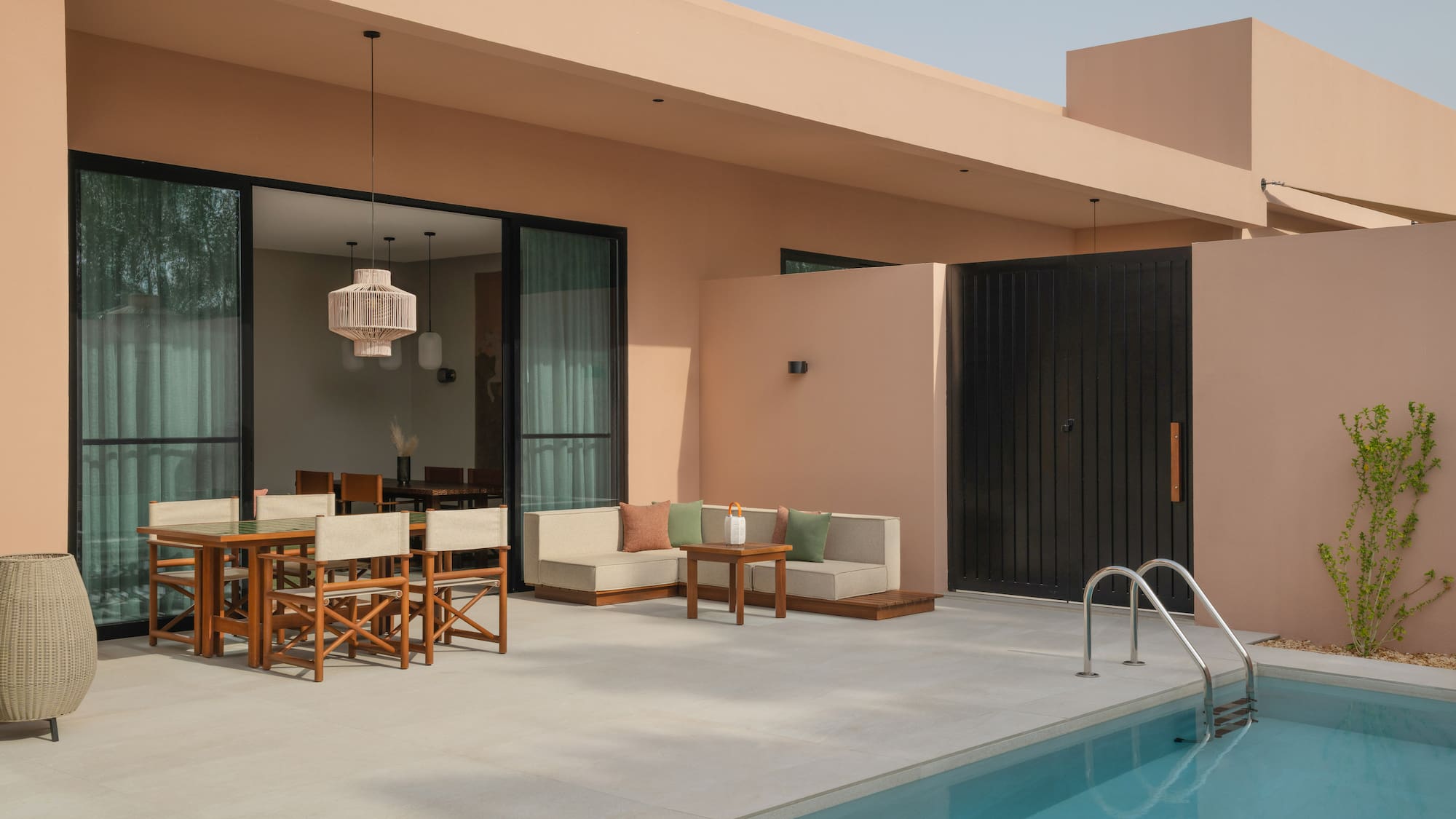 a pool with a table and chairs