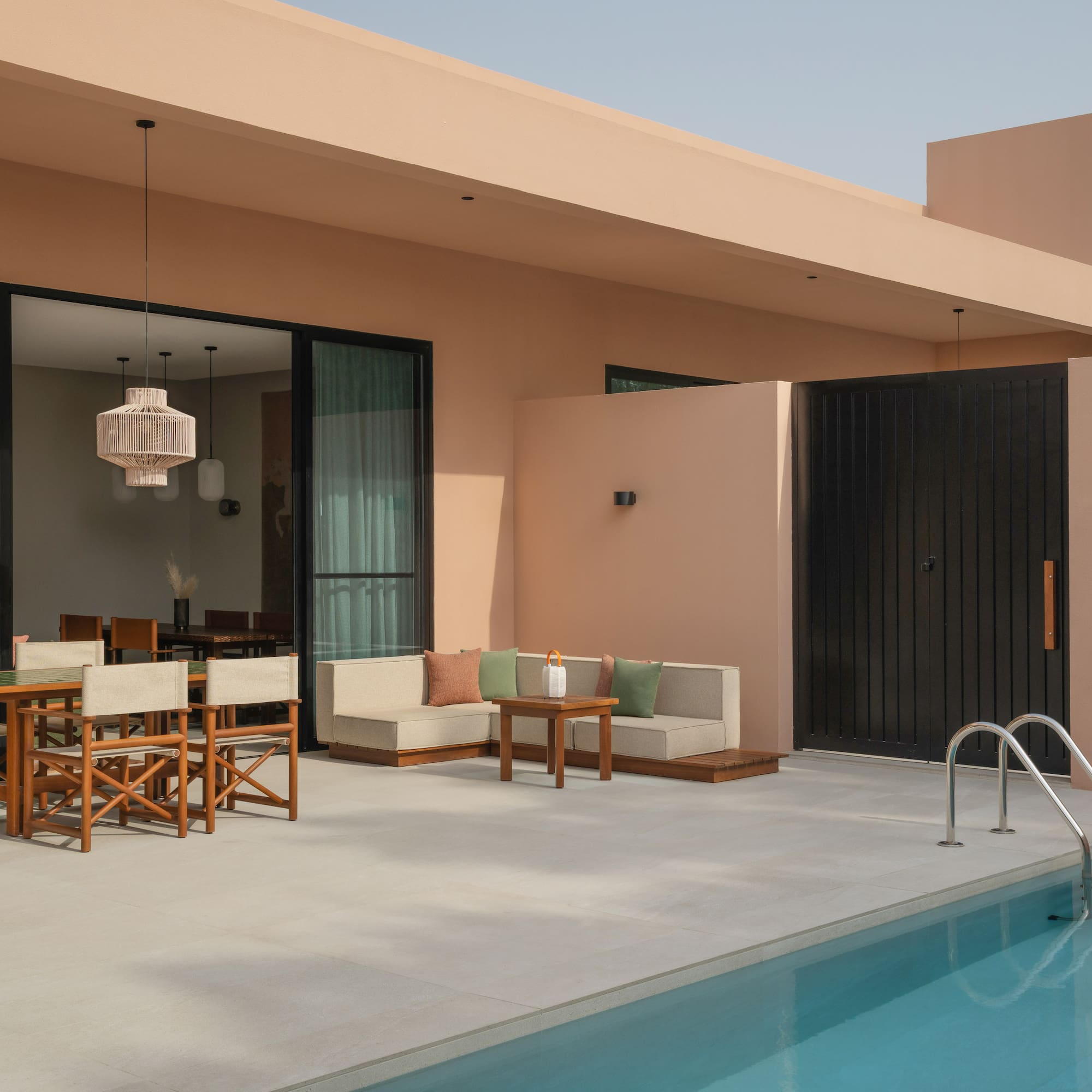 a pool with a table and chairs