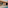 Modern peach villa with pool, patio, outdoor dining, and lounge.