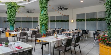 a restaurant with tables and chairs