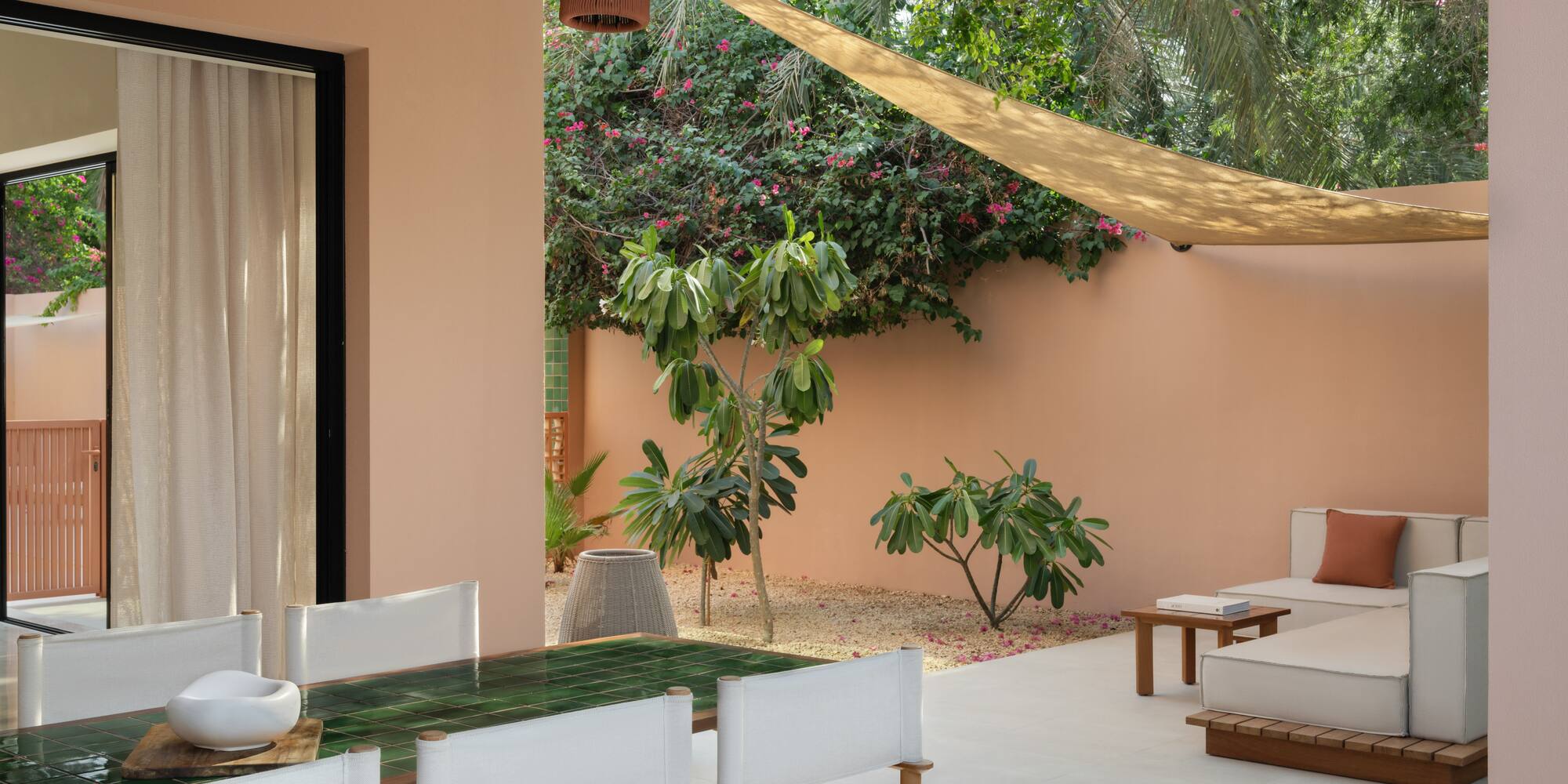 a patio with a table and chairs