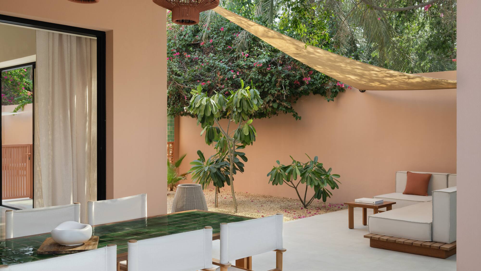 a patio with a table and chairs