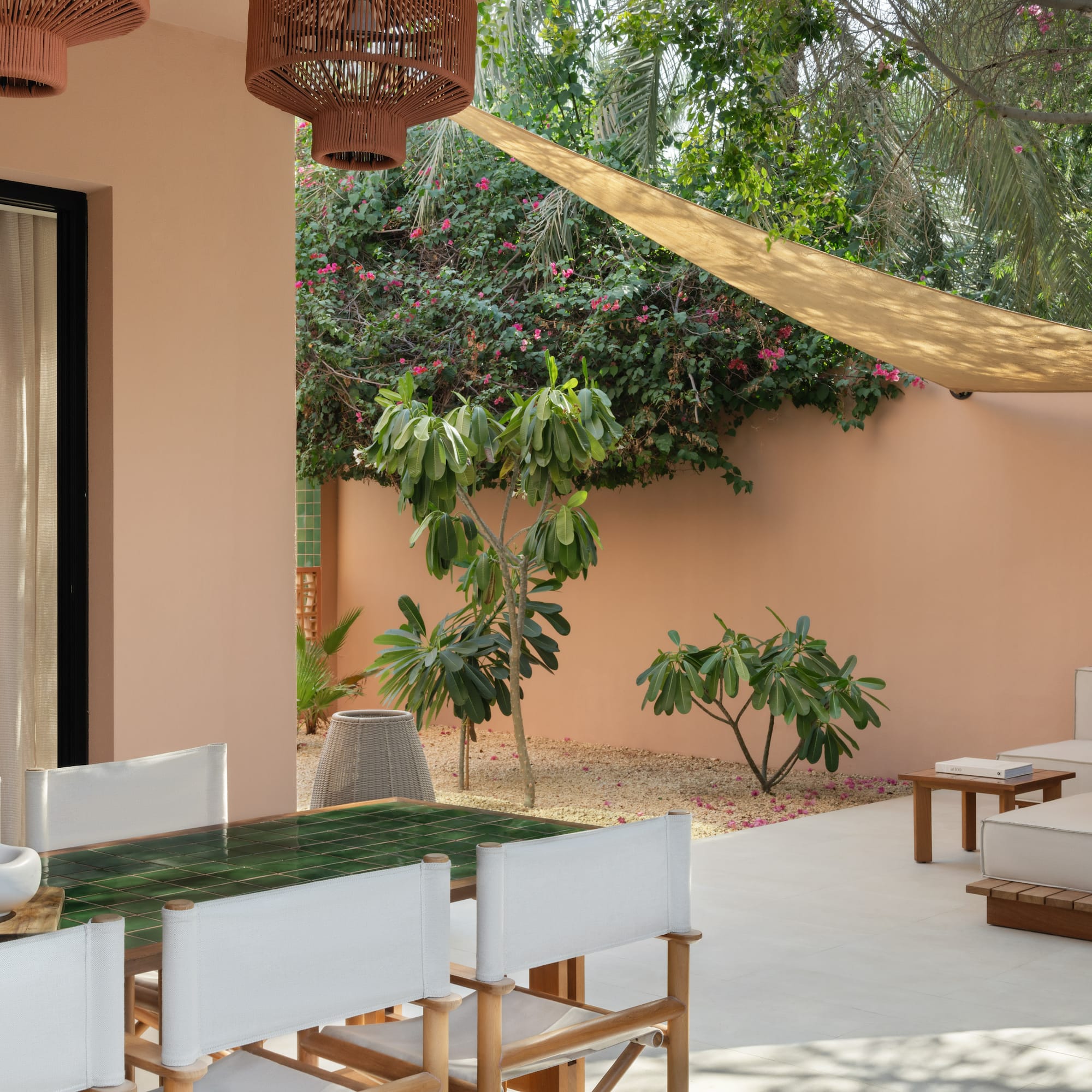 a patio with a table and chairs