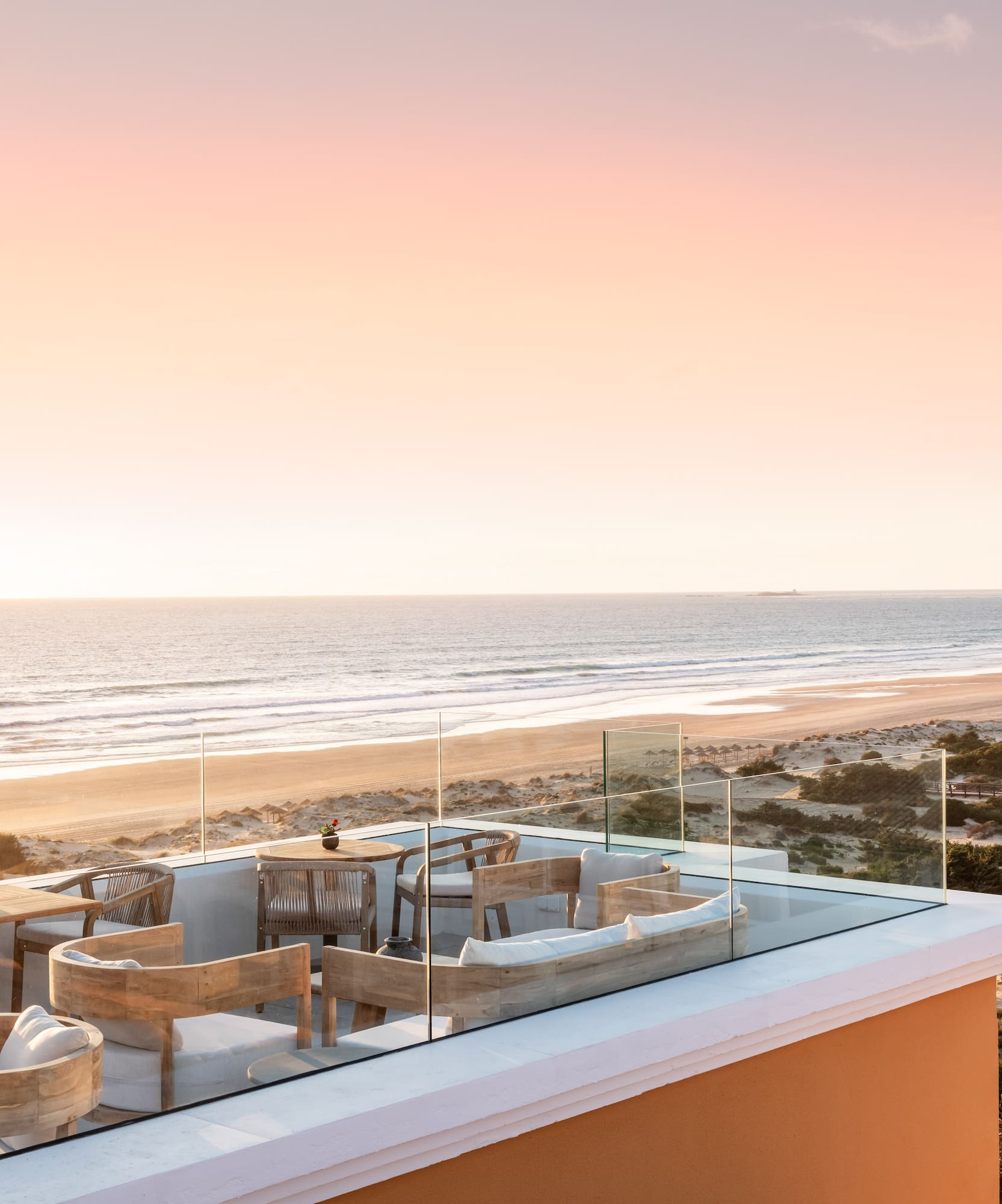 a rooftop with a beach and ocean