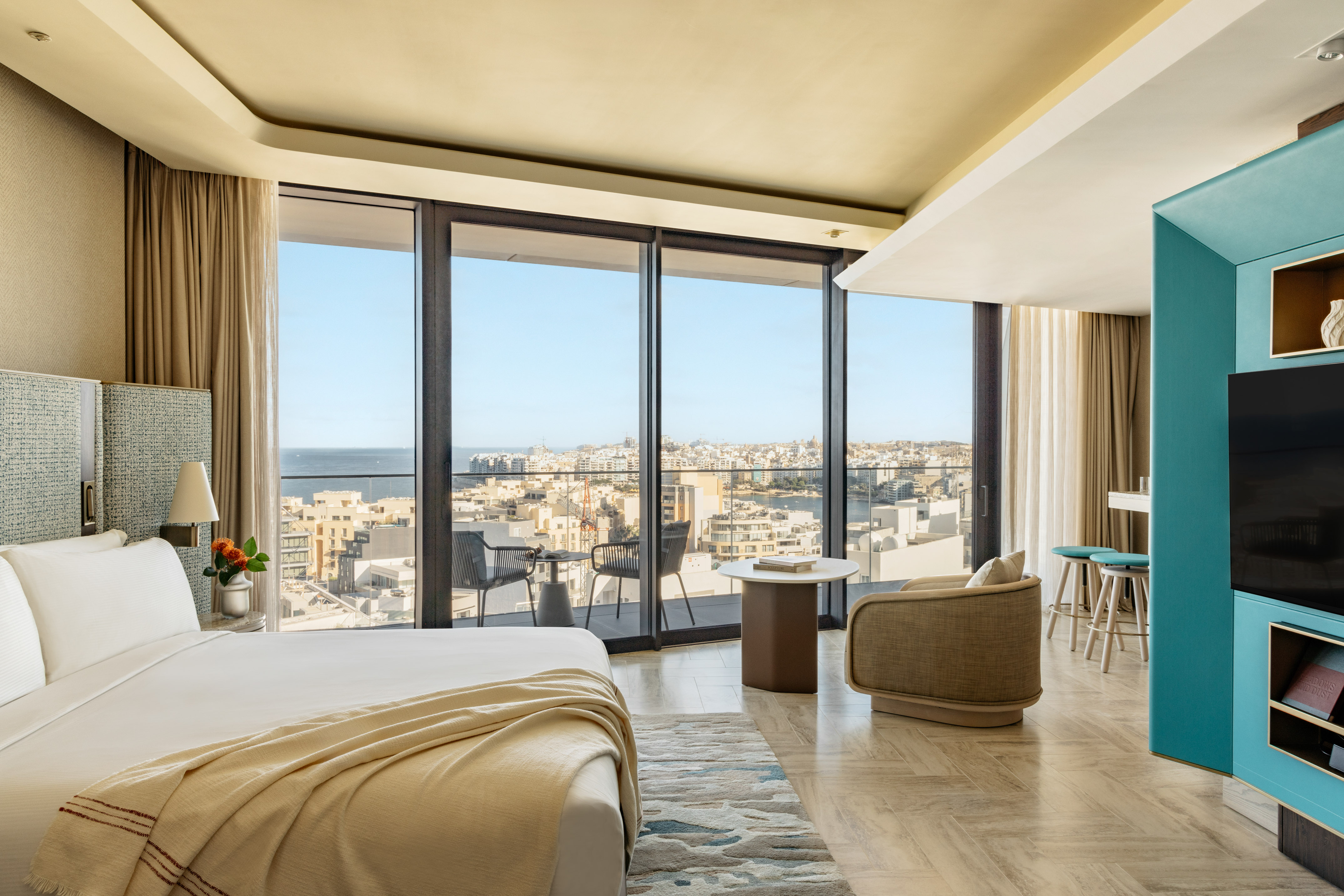 a room with a large window overlooking a city