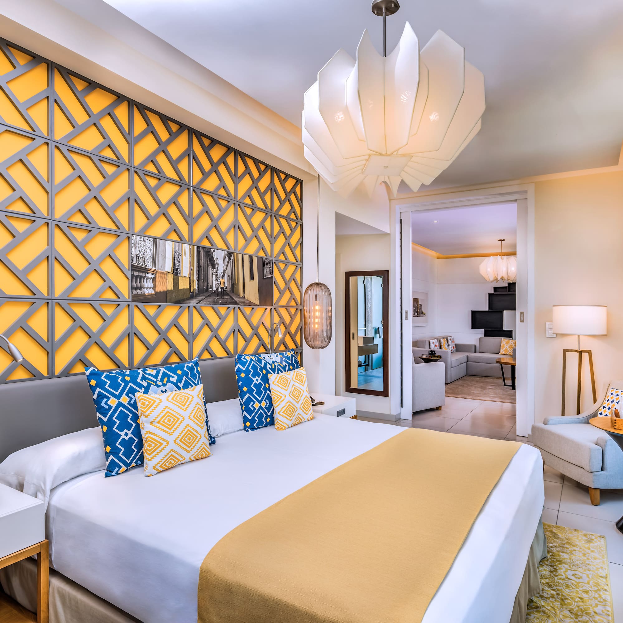 a bedroom with a bed and a lamp