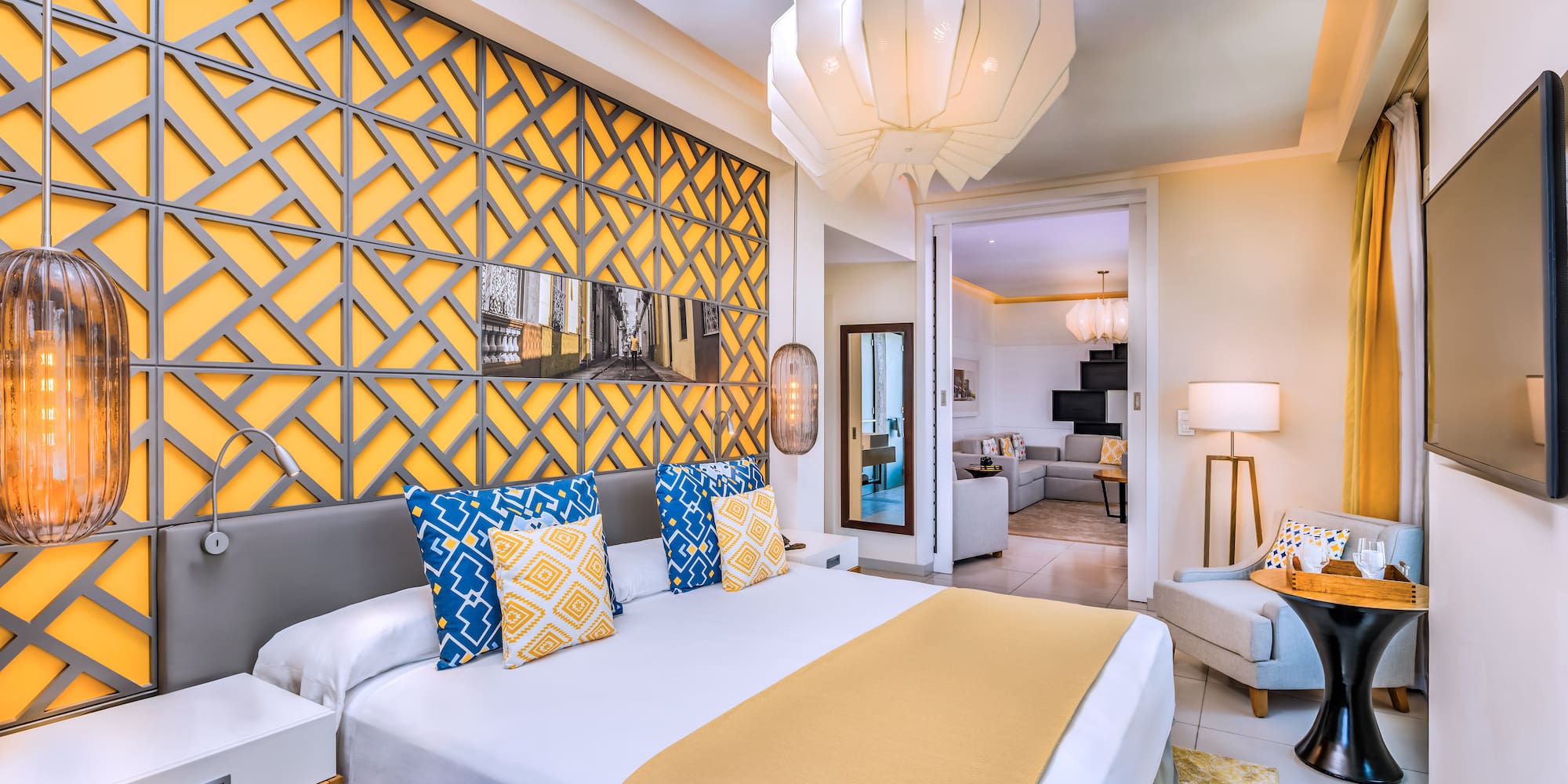 a bedroom with a bed and a lamp