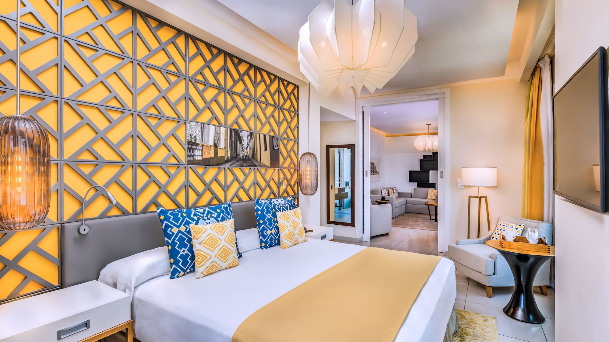 a bedroom with a bed and a lamp