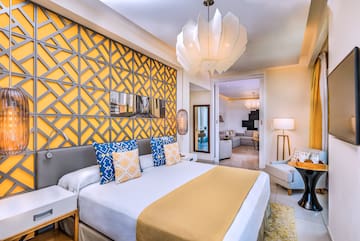 a bedroom with a bed and a lamp