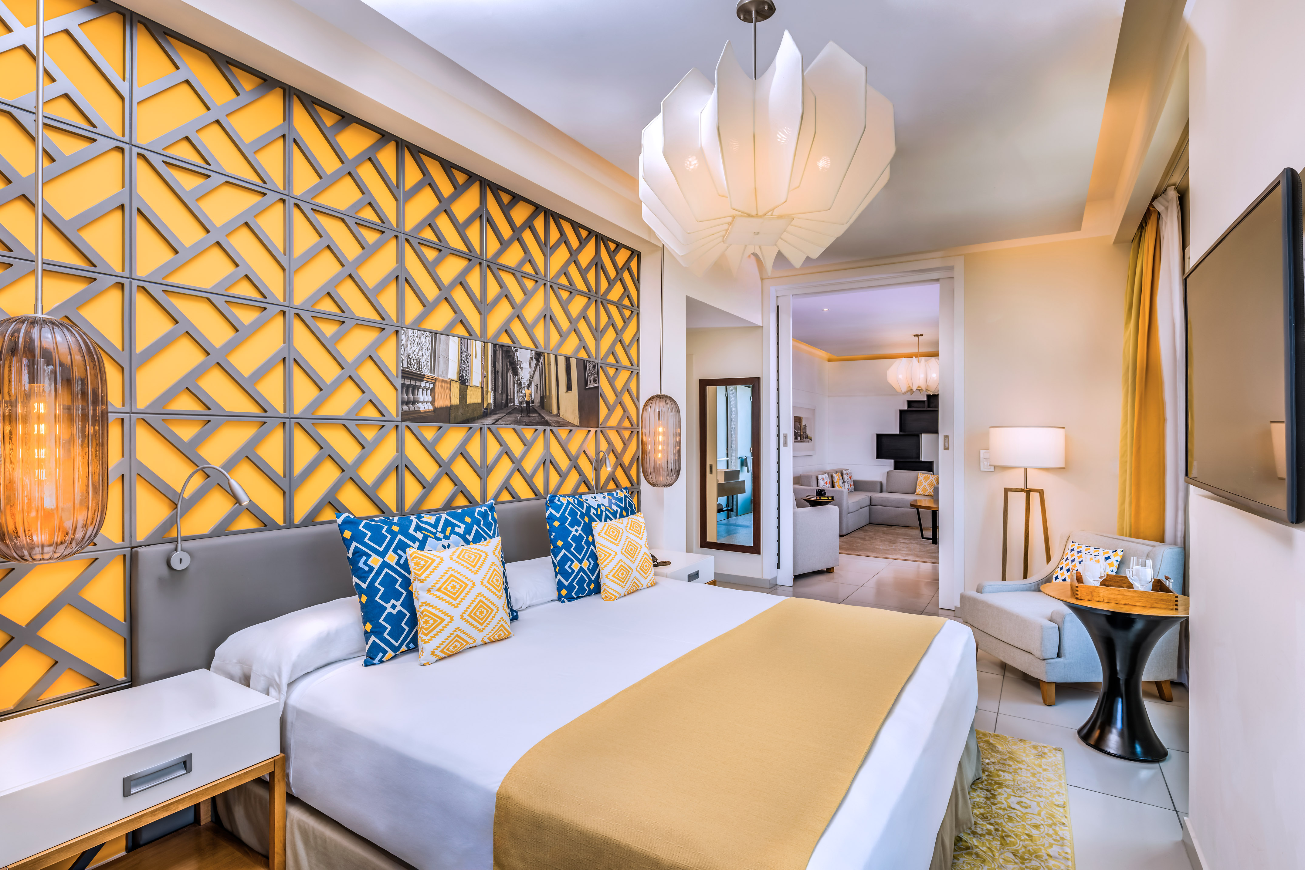 a bedroom with a bed and a lamp