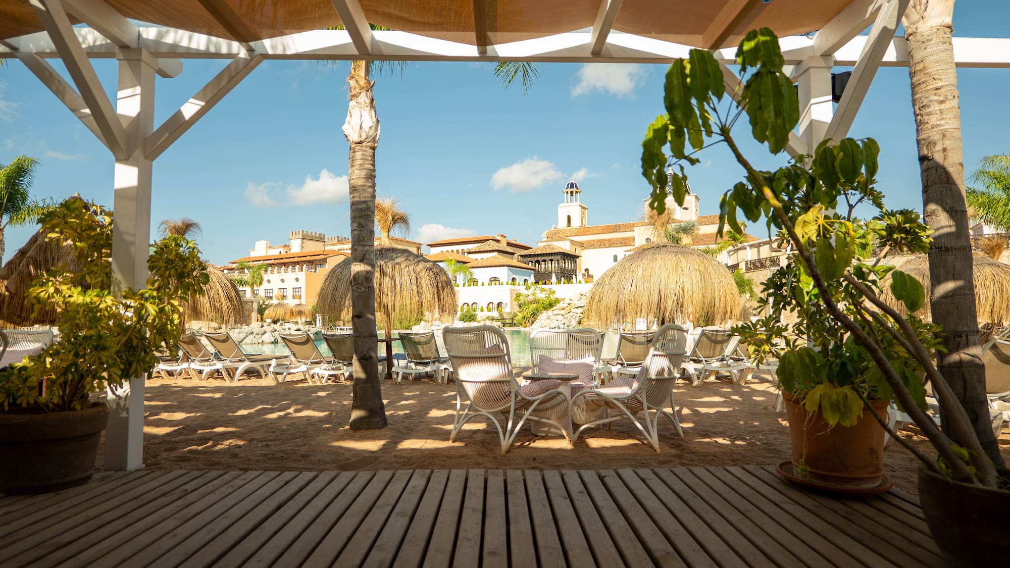 a patio area with chairs and trees