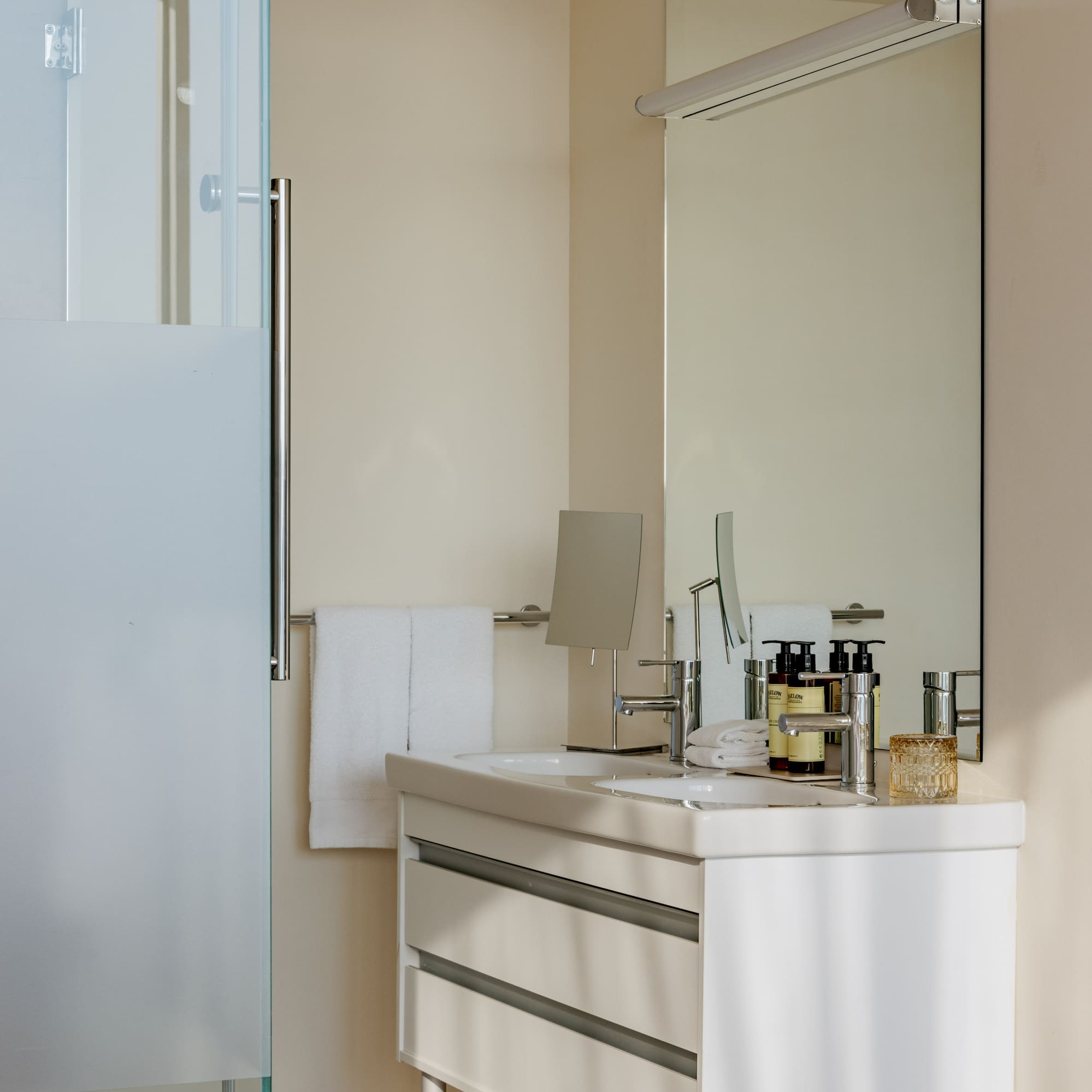 a bathroom with a mirror and sink