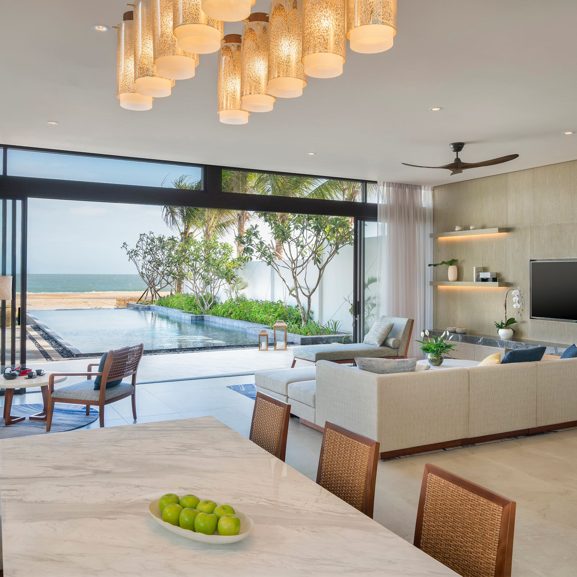 a living room with a pool and a table