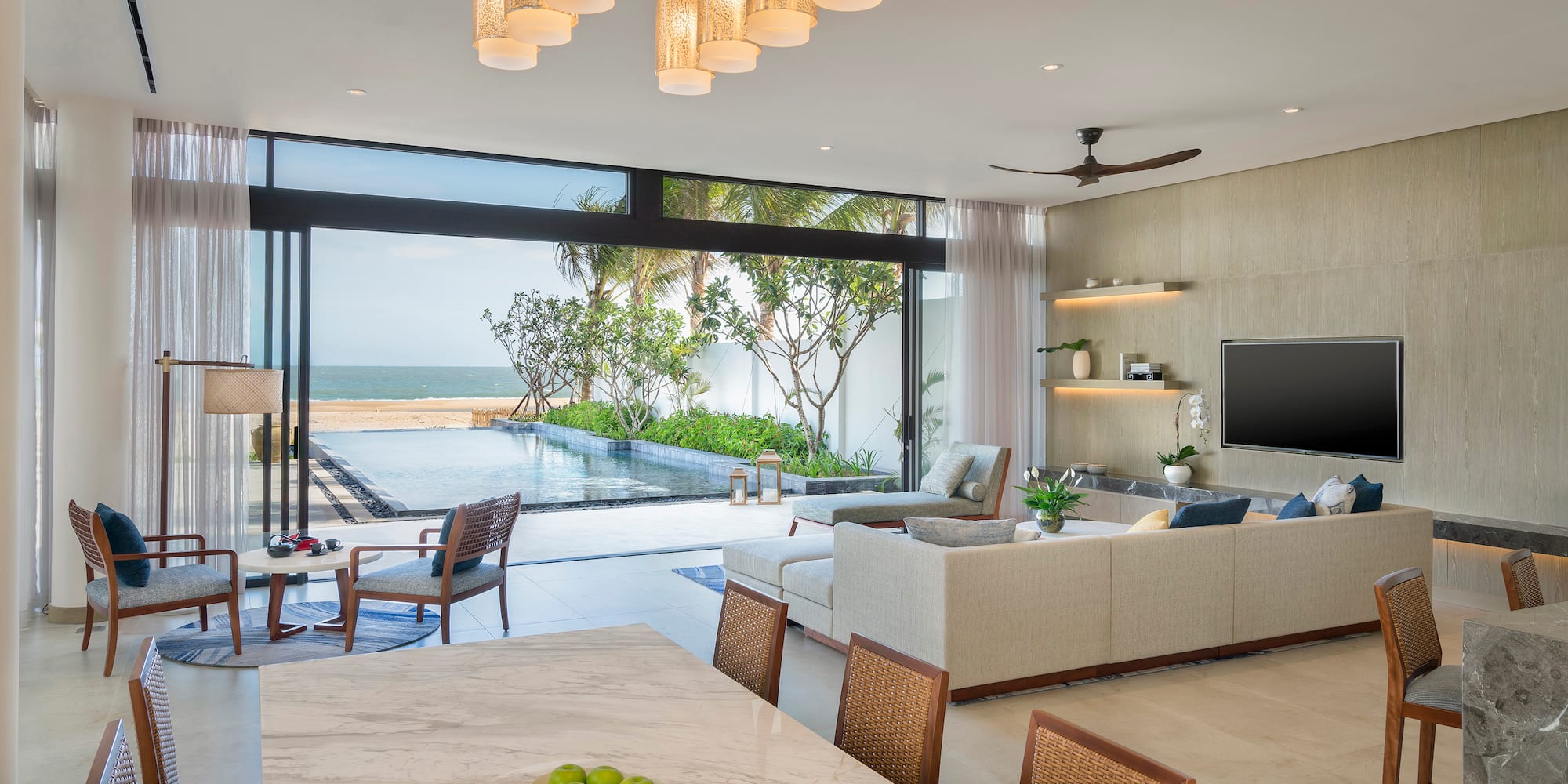 a living room with a pool and a table