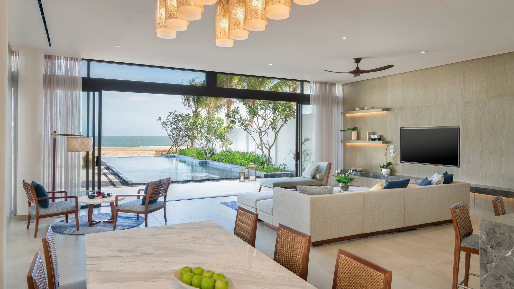 a living room with a pool and a table