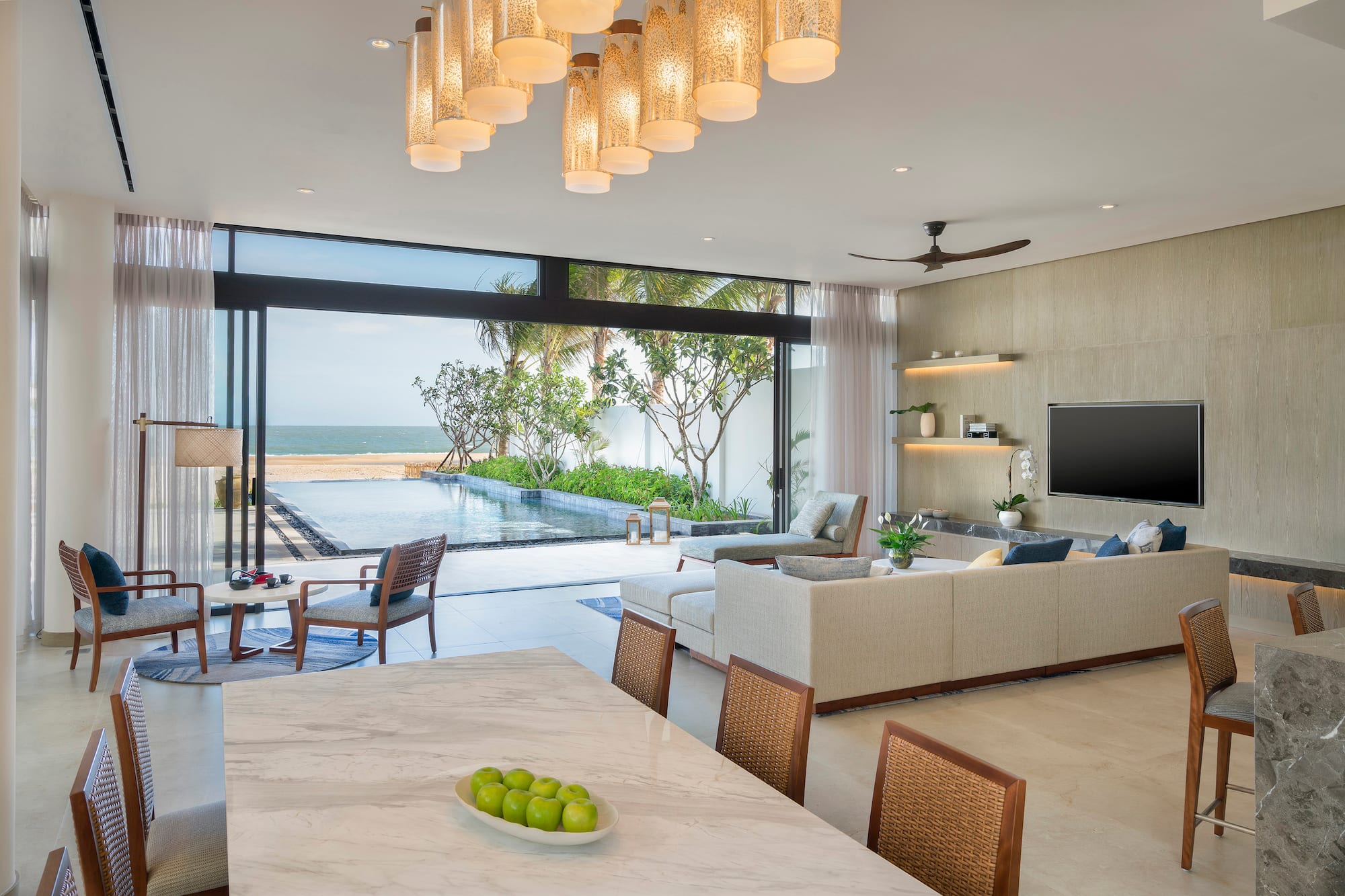 a living room with a pool and a table