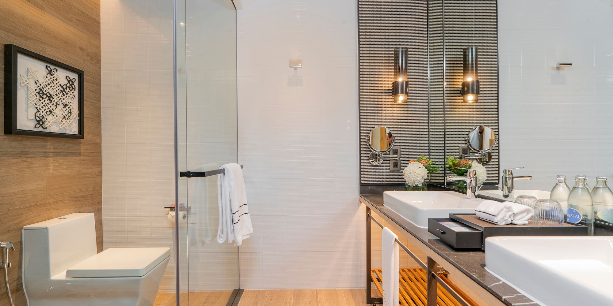 a bathroom with a glass shower and sink