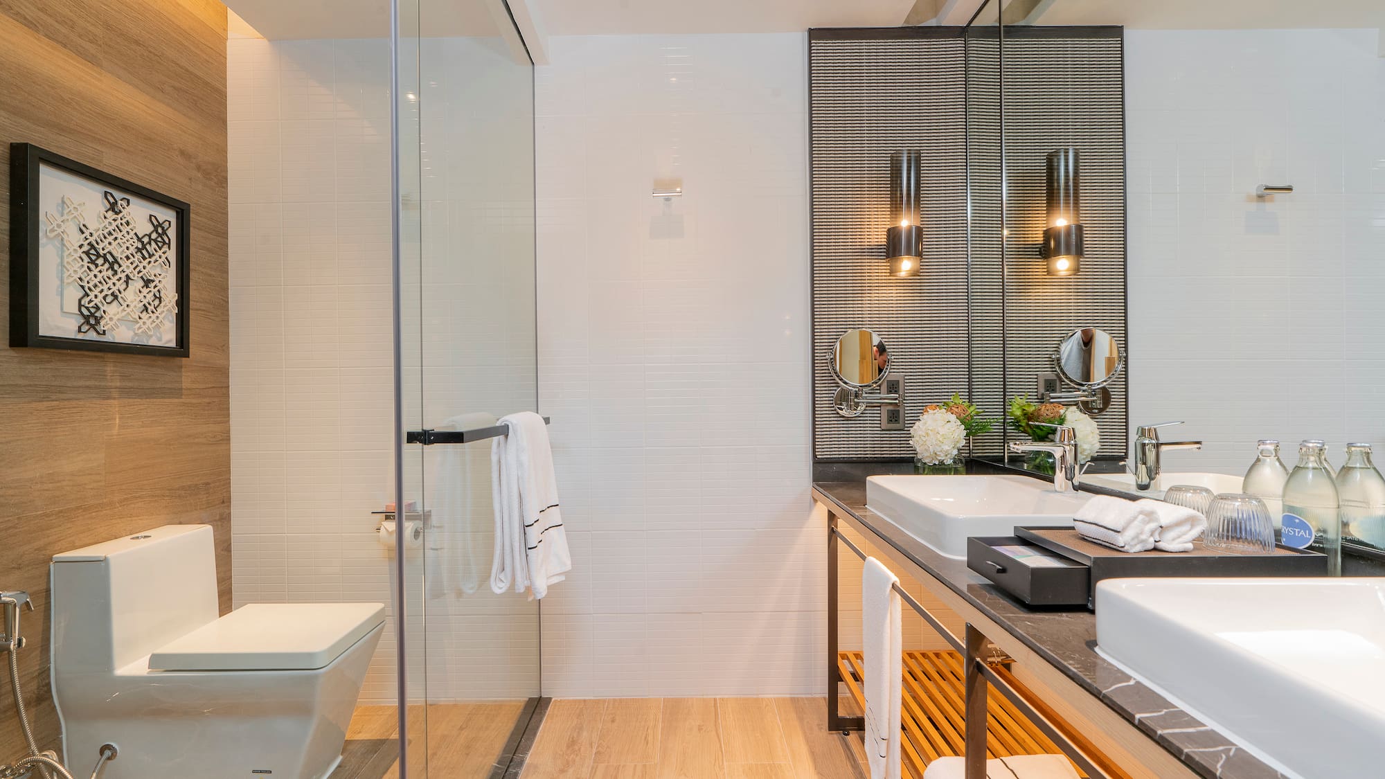 a bathroom with a glass shower and sink