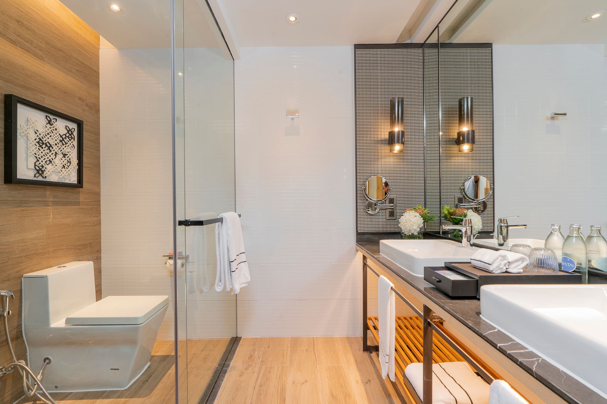 a bathroom with a glass shower and sink