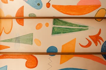 a wall with colorful drawings on it