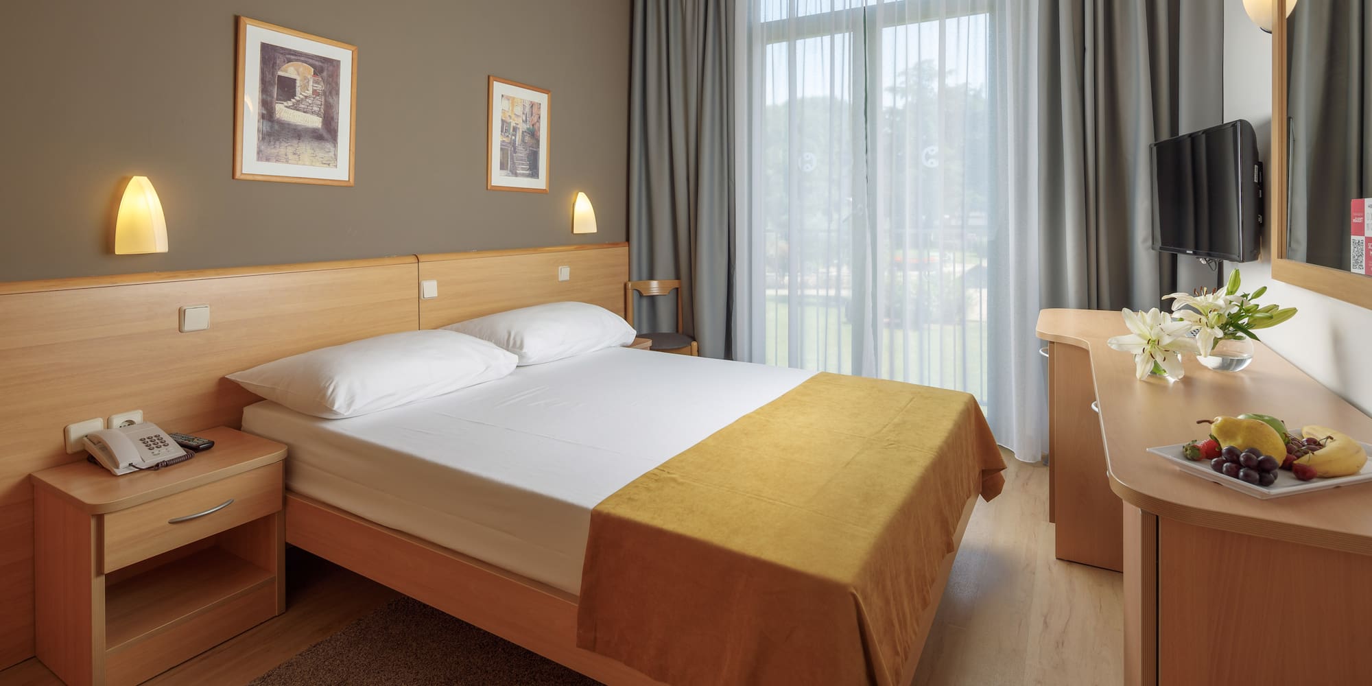 a bedroom with a bed and a desk