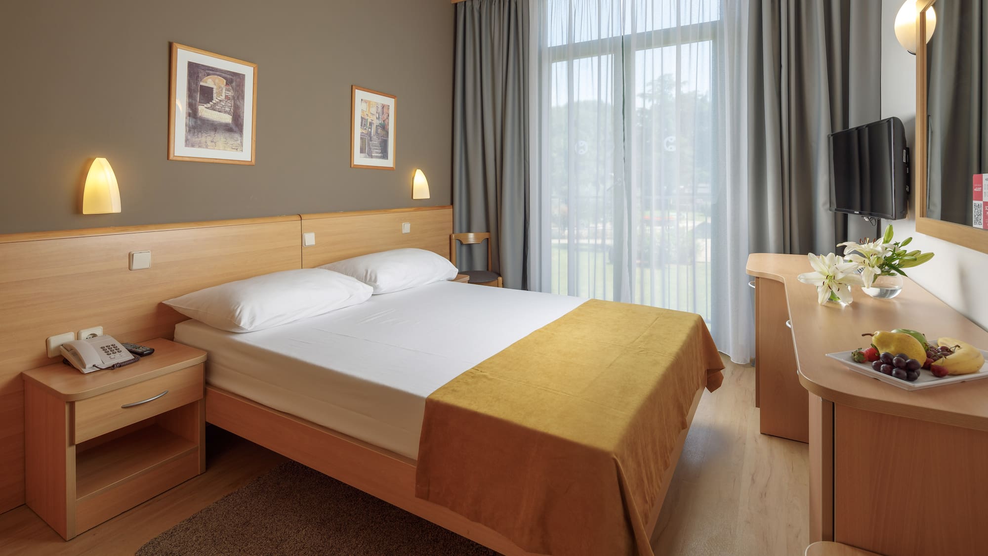 a bedroom with a bed and a desk